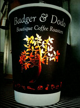 Badger & Dodo Coffee Roasters & Barista Training - image of take away coffee cup with Badger and Dodo Logo